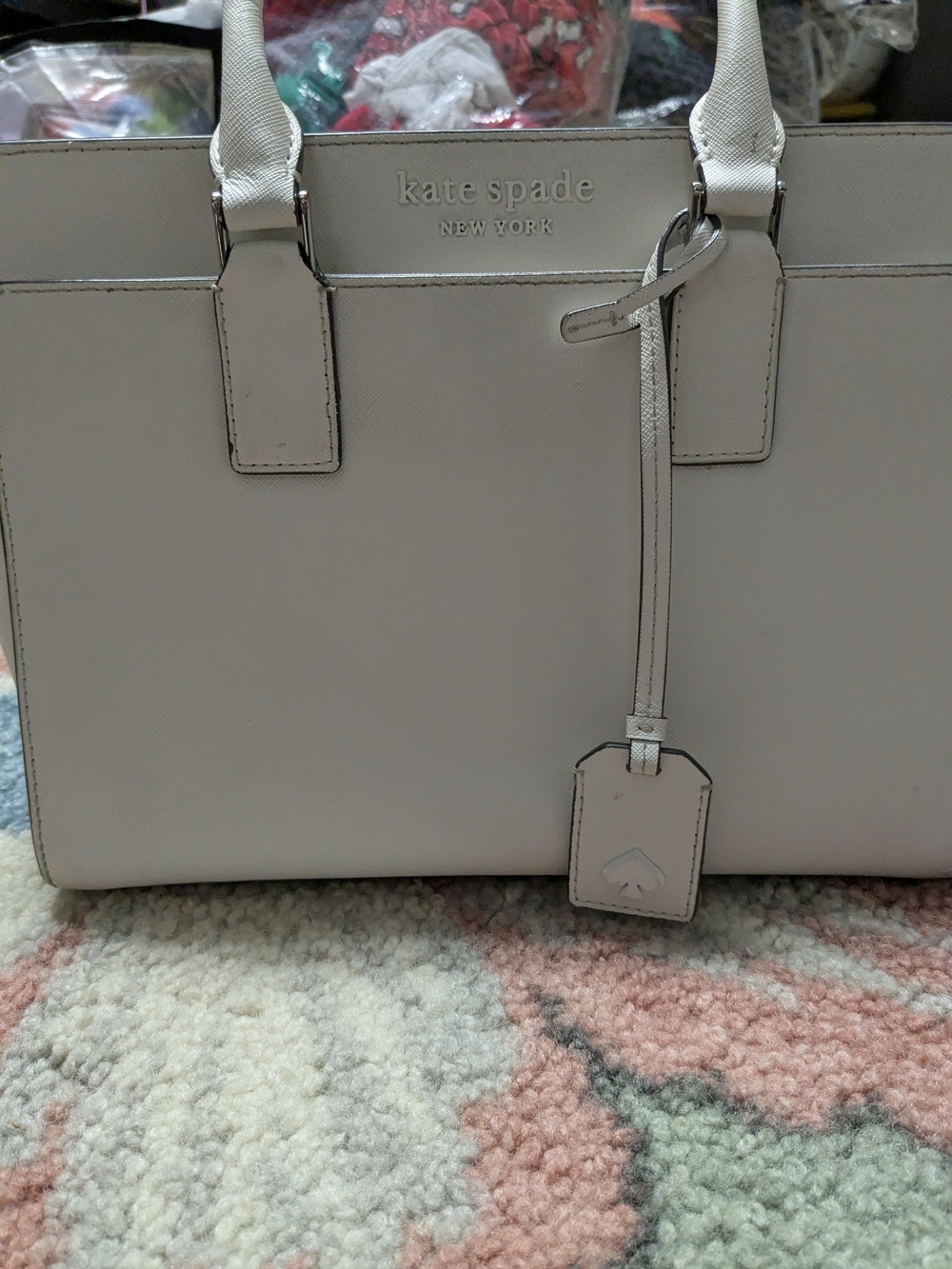 kate spade cream leather tote with luggage tag